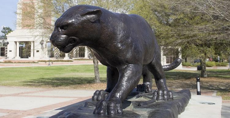 close-up of bronze statue of Jaguar in Moulton Tower plaza