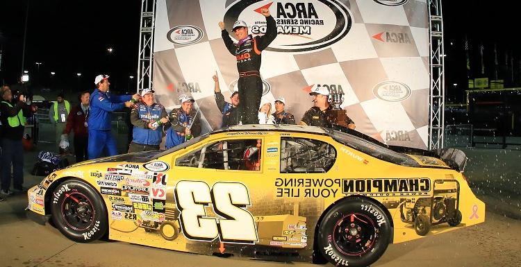 Grant Enfinger, who holds a marketing degree from USA, celebrates at Kansas Speedway in October after winning the 2015 ARCA Racing Series championship. 